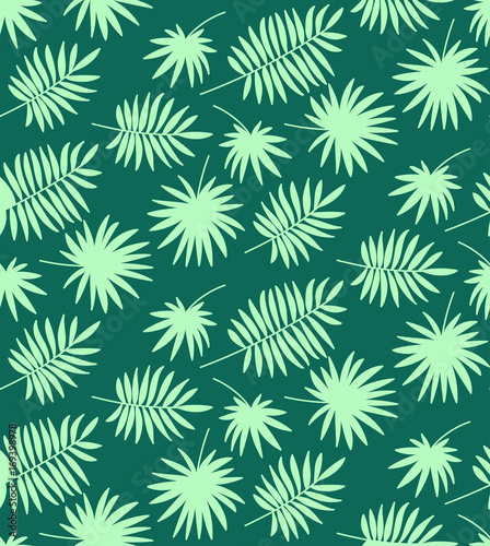 Seamless pattern made of palm leaves on green blue background