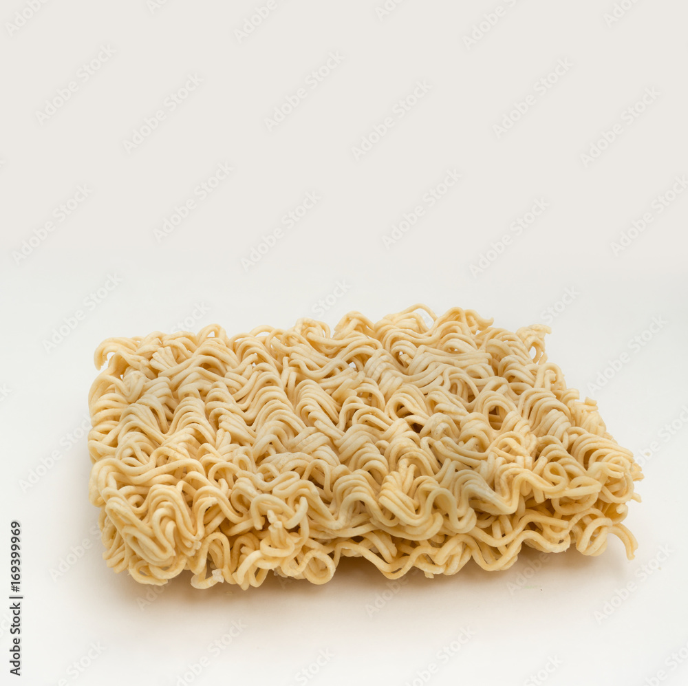 piece of instant noodles on paper white background,copy space piece of instant noodles on paper white background,copy space