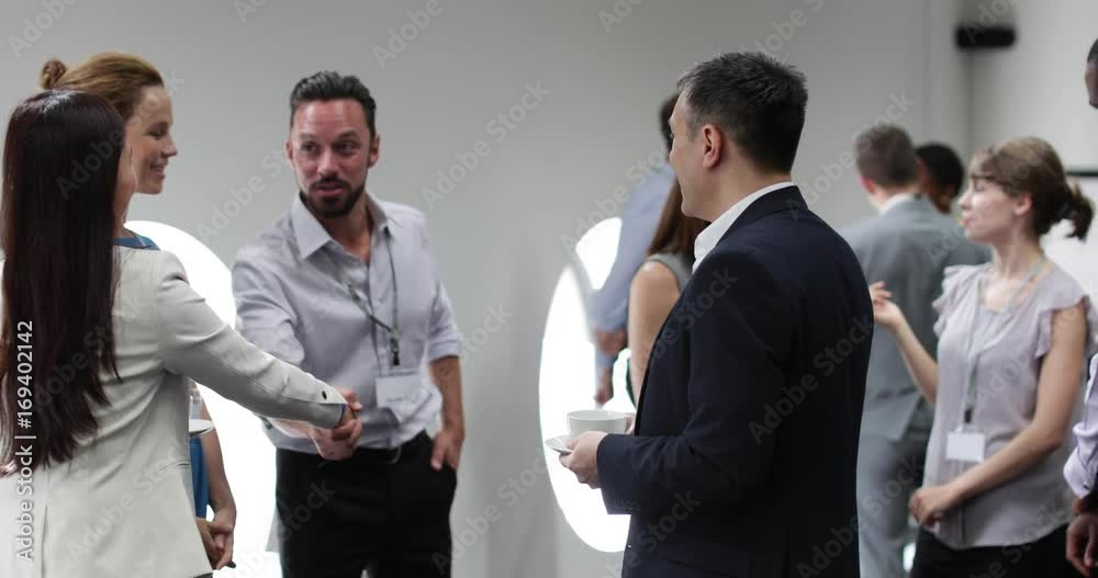 Business executives shaking hands at a networking event