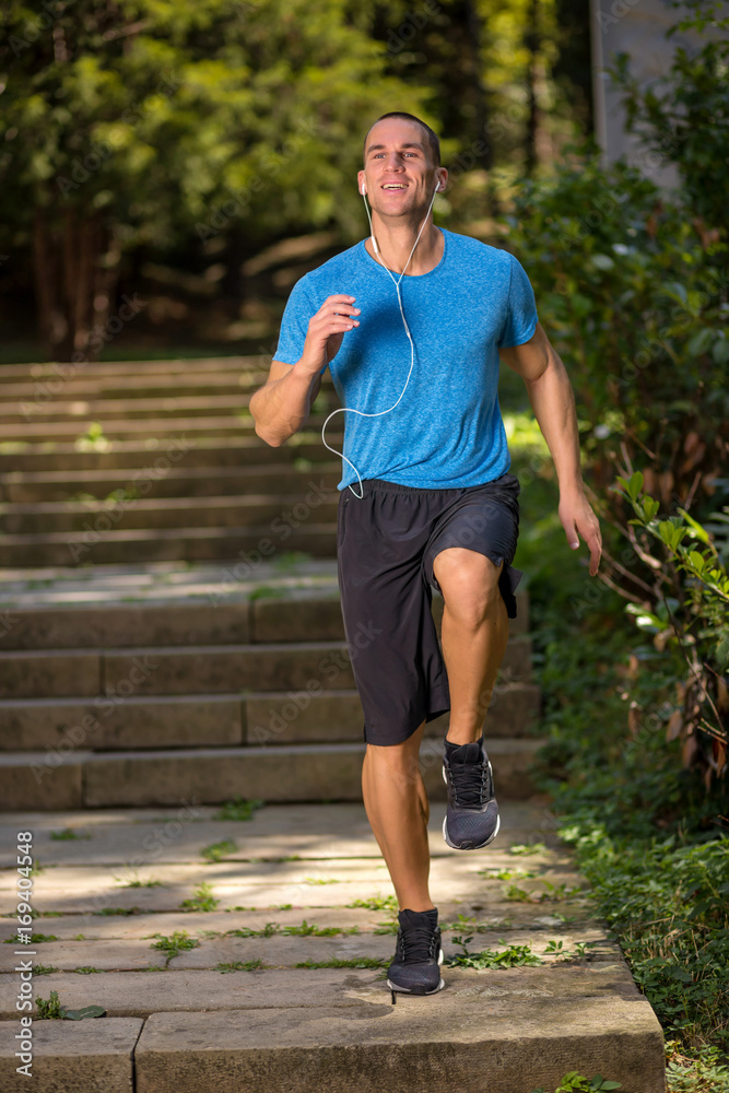 urban fitness lifestyle a young man working out outdors urban fitness lifestyle a young man working out outdors