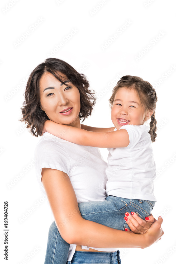 smiling asian mother hold in hands her adorable daughter, isolated on white smiling asian mother hold in hands her adorable daughter, isolated on white