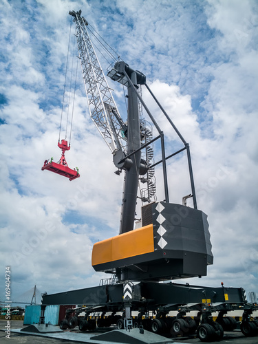 Mobile harbor crane for loading/discharging container at industrial port.