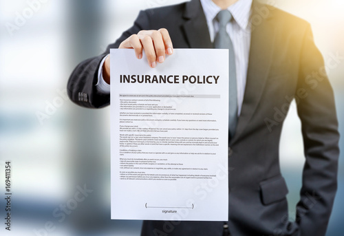 businessman show insurance policy