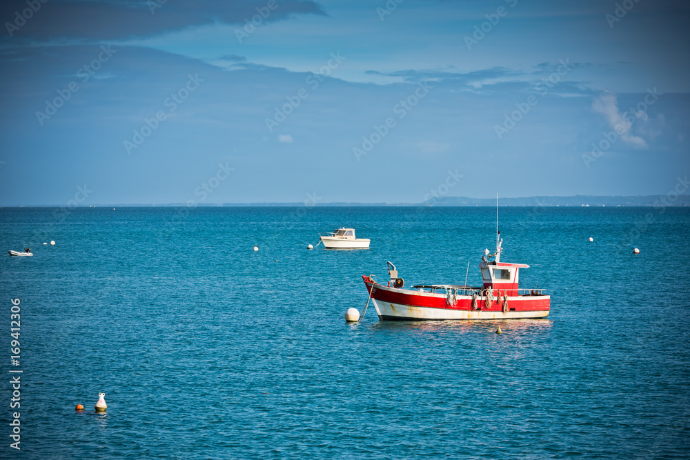 Bright blue sea and fisherman boats