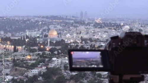 Camera shoots photo timelapse of the Jerusalem Old City view landscape. Mount Scopus is a famous Holy Land place and it has a fantastic view to the Old Jerusalem. photo