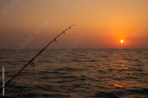 Fishing rod on the background of beautiful sunset