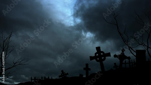 Sinister view - night cemetery, stormy sky and lightning photo
