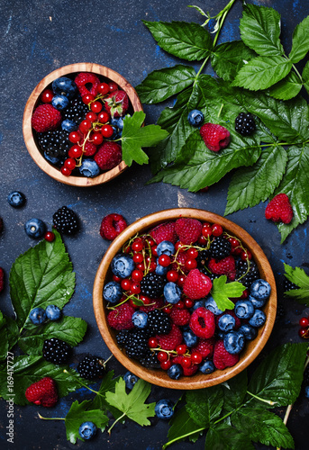 Mix of summer berries, food background, top view