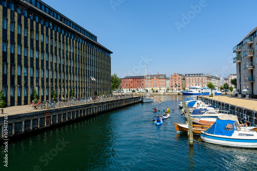 Photography Children are kayaking in a water canal in Copenhagen, Denmark