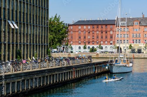 Canvas Print Children are kayaking in a water canal in Copenhagen, Denmark