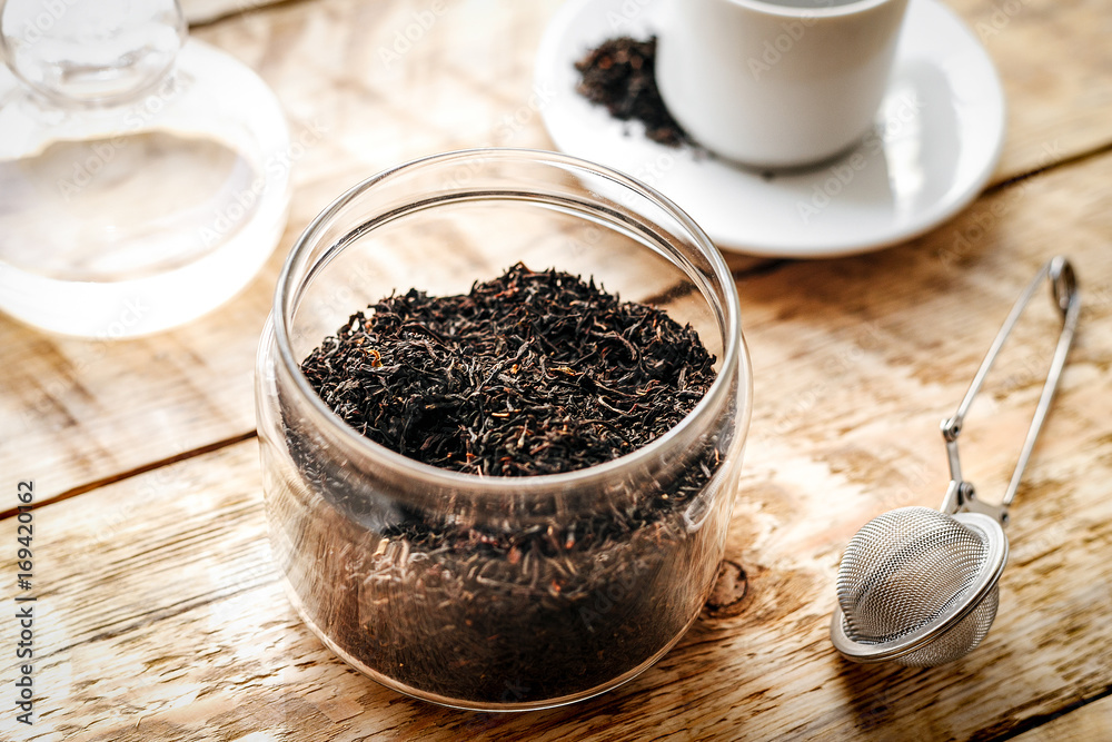 Tea set on the wooden table at sunny morning