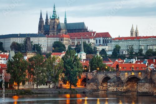 It's evening in the city of Prague. View of the Prague Castle and the Charles Bridge. Czech Republic.