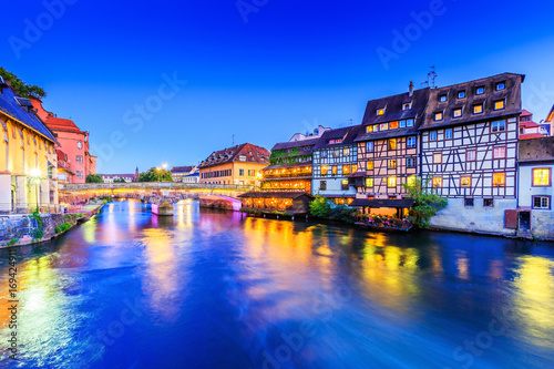 Strasbourg, Alsace, France. Traditional half timbered houses and Saint Martin bridge of Petite France. photo