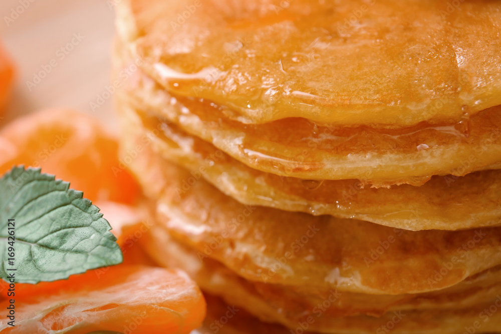 Delicious pancakes with honey, close up Delicious pancakes with honey, close up