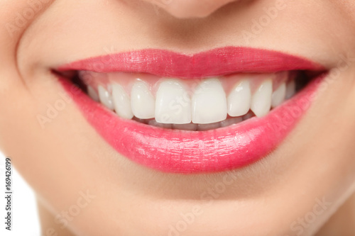 Beautiful young woman with healthy teeth, close up