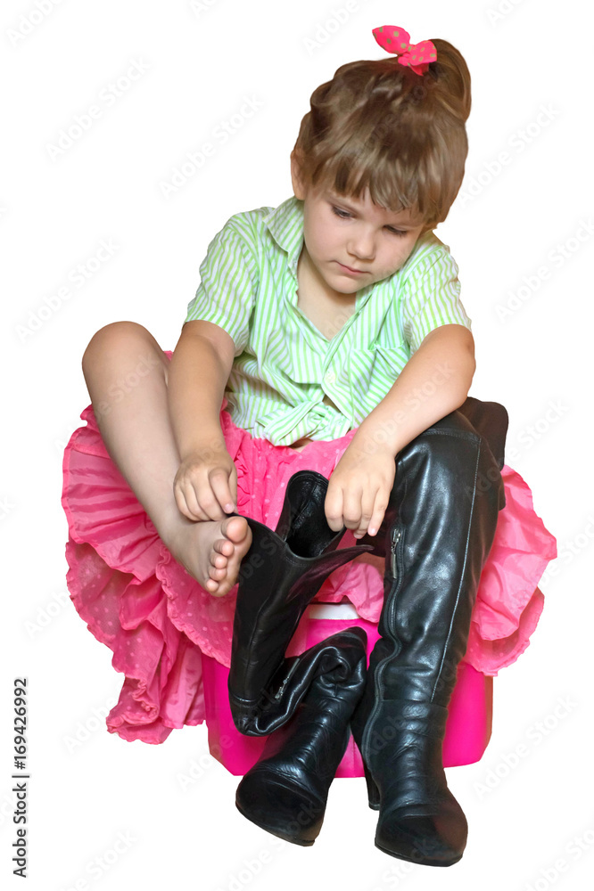 High black boots (hessian boots). Little girl tries on her mother's ...
