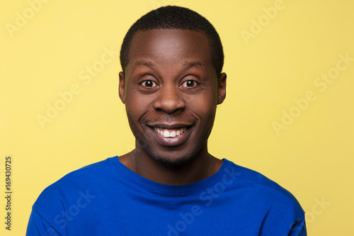 Positive amazement. Surprised African American. Happy news for black man, handsome male portrait, facial expression concept