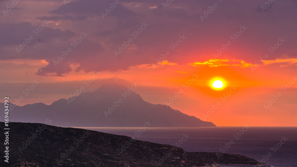 Stormy sky and sunrise at holy mountain Athos in Greece