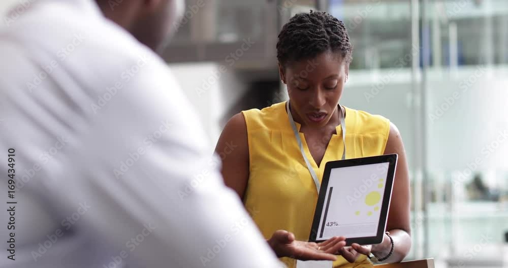 Businesswoman in a meeting using a digital tablet