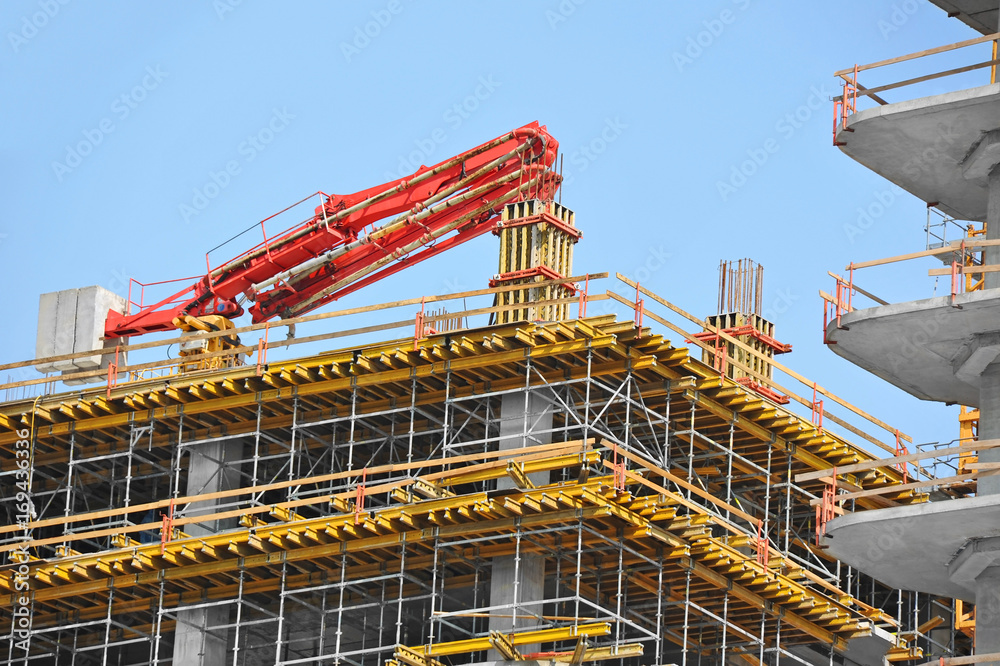 Crane and highrise construction site Crane and highrise construction site