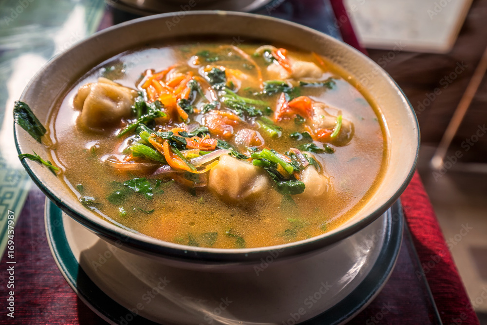 Traditional tibetian food is momo soup with vegetables Darjeeling, India. Traditional tibetian food is momo soup with vegetables Darjeeling, India.