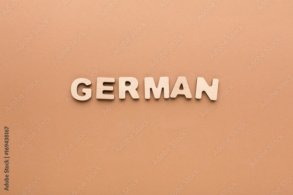 Word German on beige background