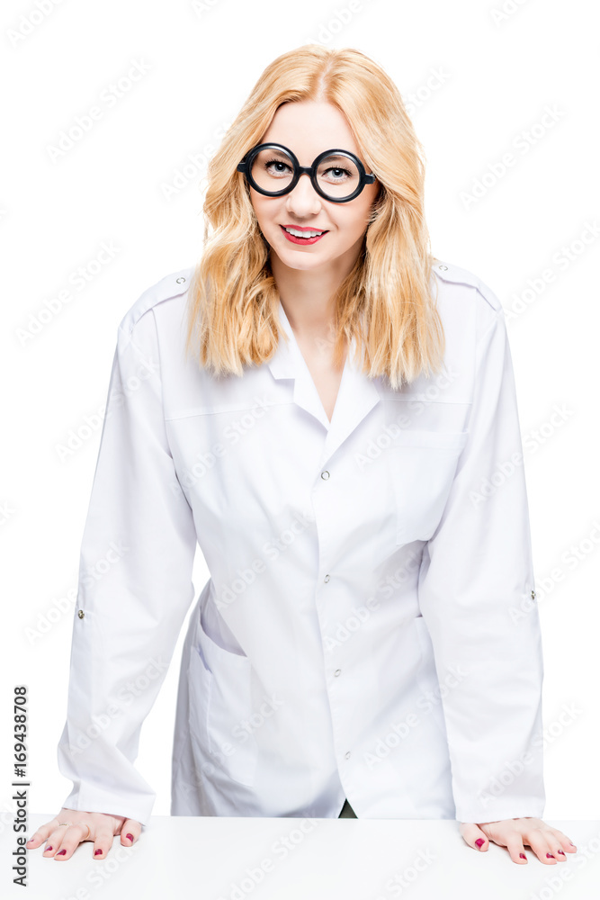 Portrait of a blond doctor with funny glasses on a white background