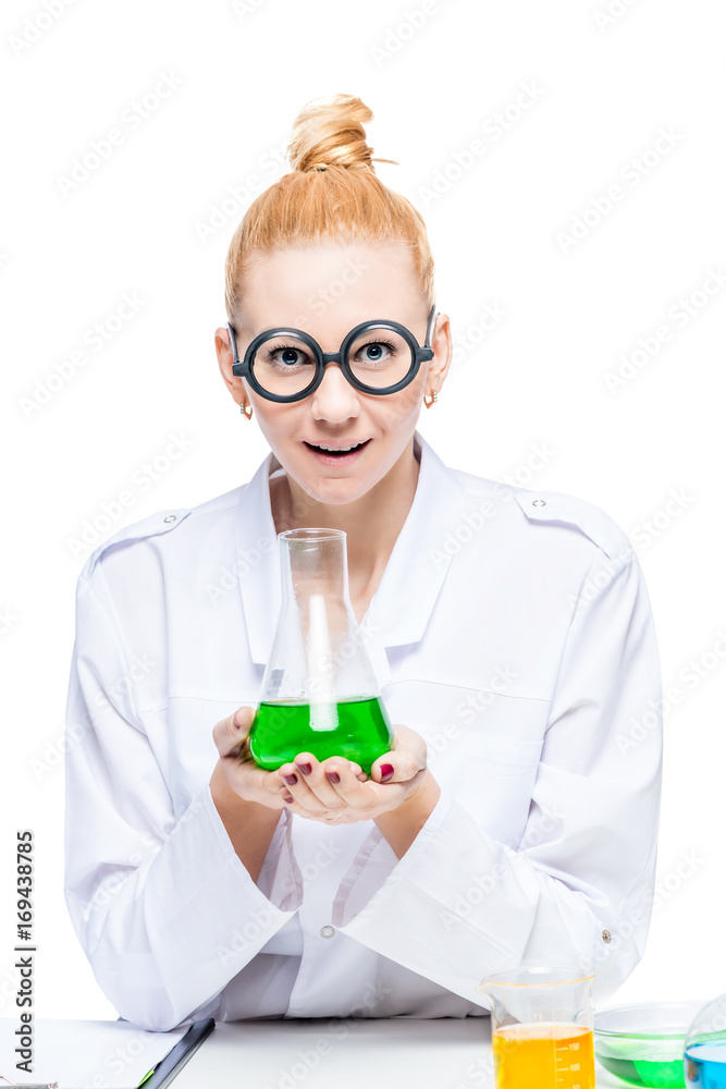 Beautiful blonde in round funny glasses with a bulb with green liquid Beautiful blonde in round funny glasses with a bulb with green liquid