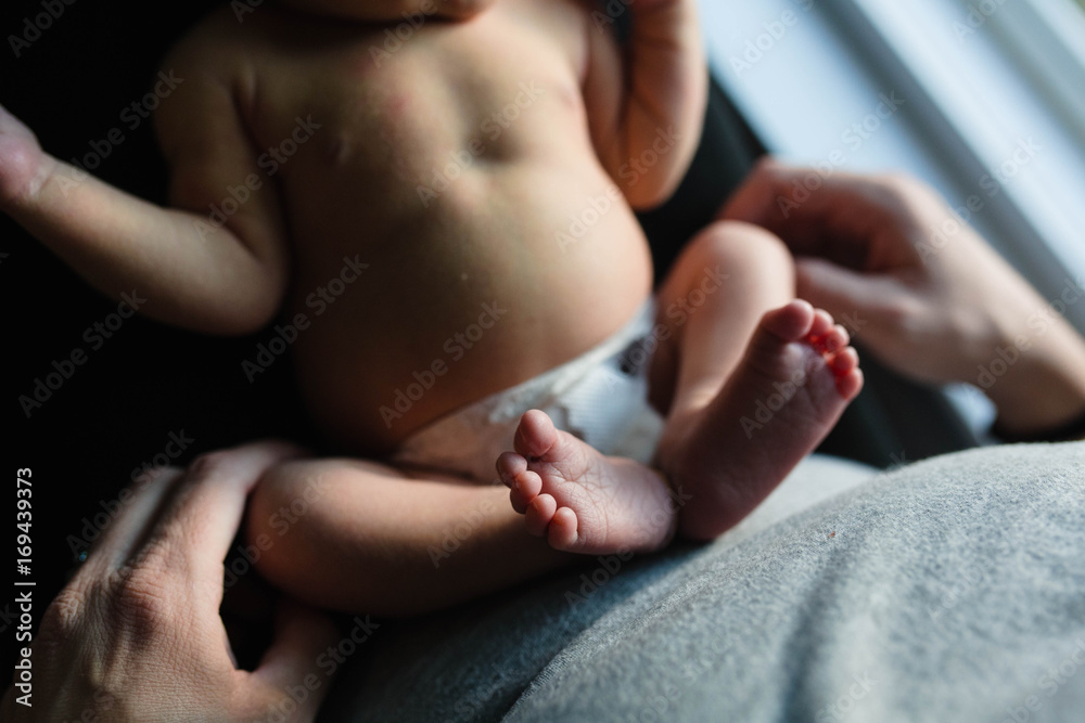 A mother holds newborn baby A mother holds newborn baby