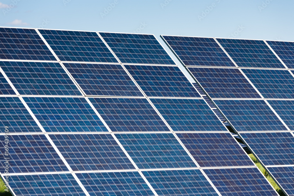 Solar panels against blue sky background Solar panels against blue sky background