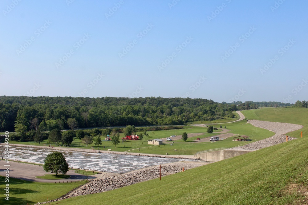 A view of the landscape and the creek from top of the dam.