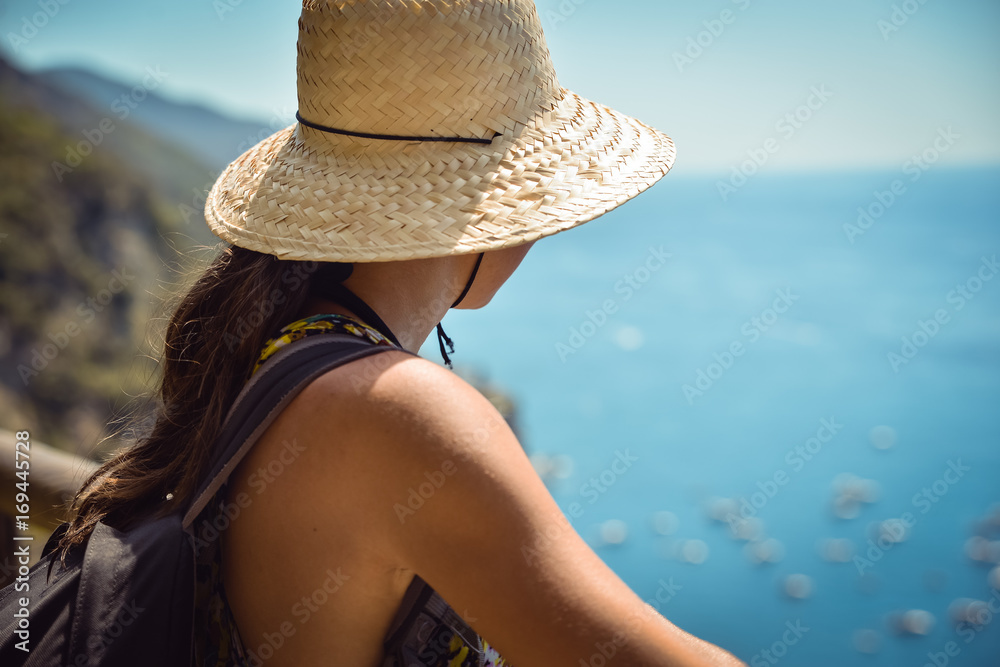 Girl by the sea, enjoying the view
