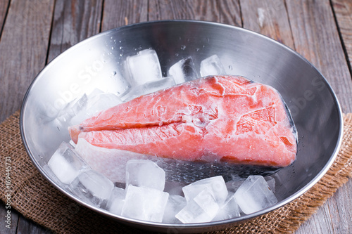 frozen red fish steaks with ice