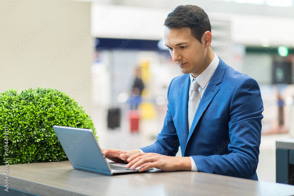 Young businessman using his laptop Young businessman using his laptop