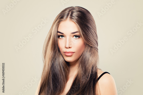 Healthy Woman with Perfect Skin and Long Brown Hair. Young Beauty