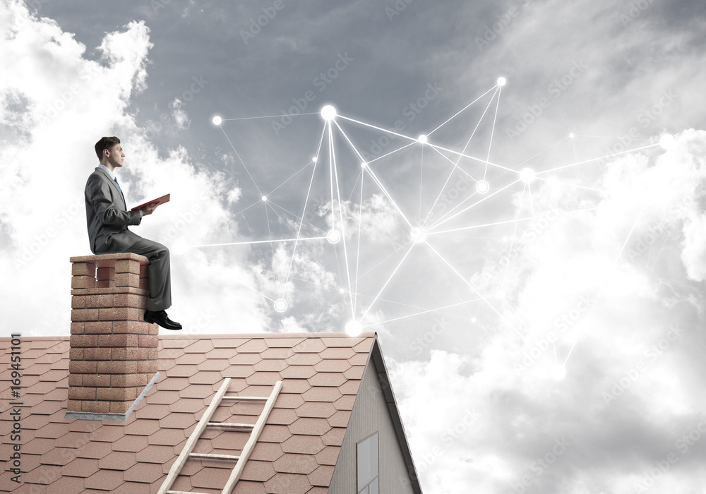 Man reading book and concept of social connection in sky Man reading book and concept of social connection in sky