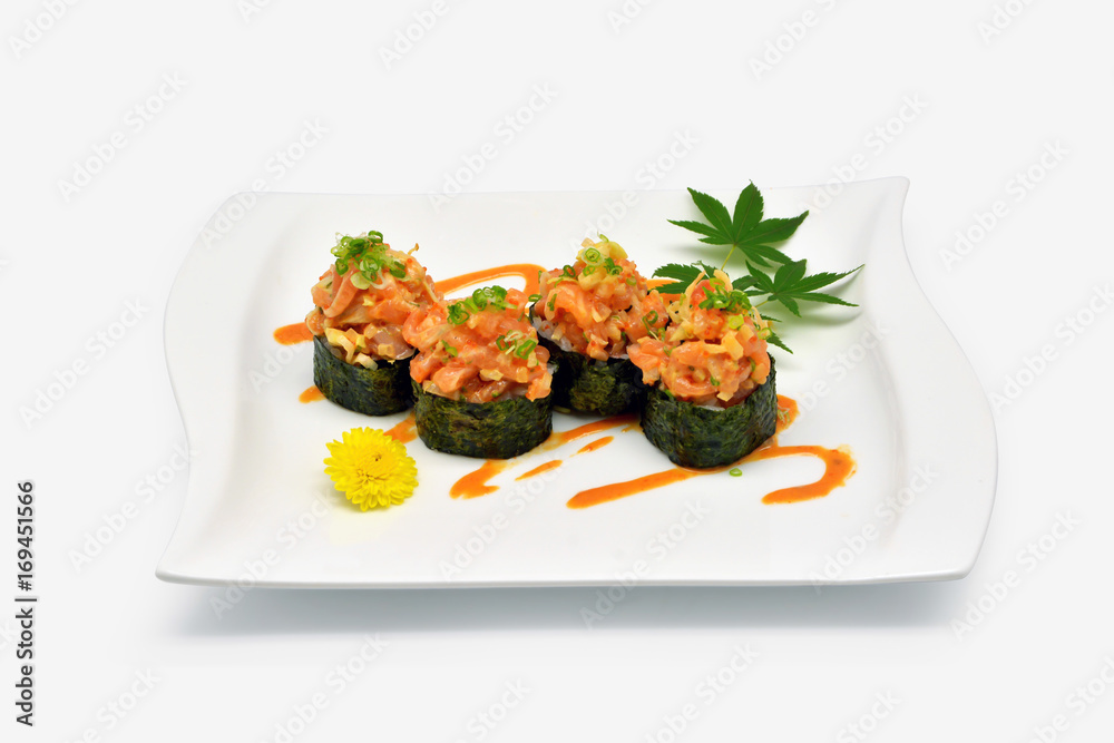 Spicy salmon shushi, Spicy salmon rolls in white plate on white background Spicy salmon shushi, Spicy salmon rolls in white plate on white background