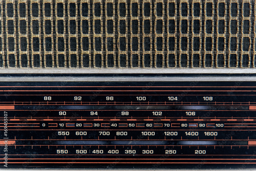 Closeup of old type loudspeaker weaving with thread. Retro loudspeaker wallpaper.