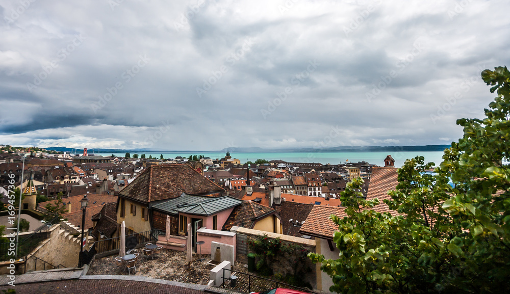 Top view of the medieval town Neuchatel with Lake Neuchatel and the Bernese Alps Chaumont seen on the horizon.