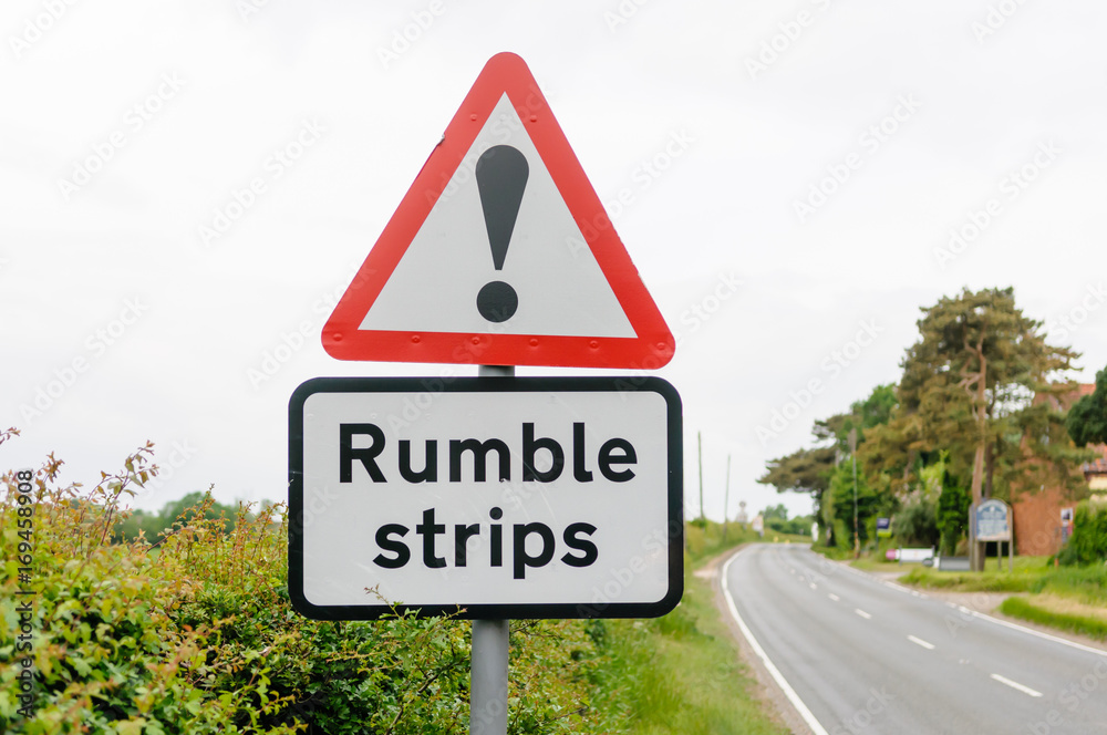 Road sign warning drivers of the presence of rumble strips to control speed