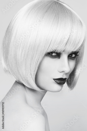 Black and white portrait of young beautiful woman with stylish bob haircut