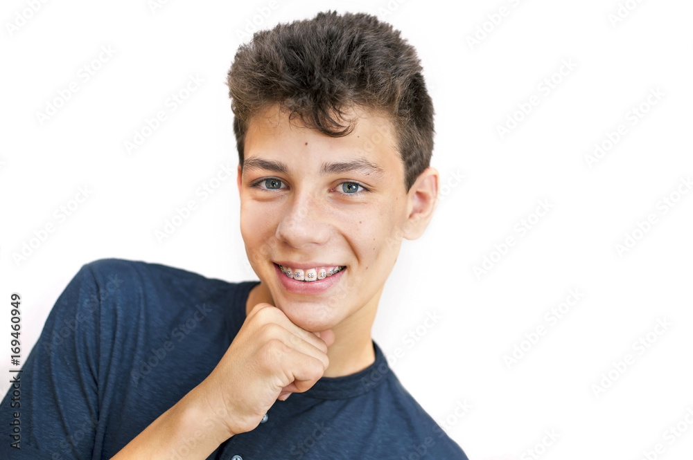 A pretty teenager on a white background with braces A pretty teenager on a white background with braces