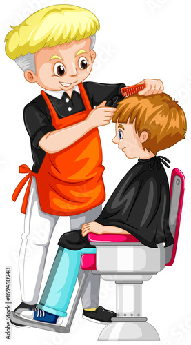 Little boy getting haircut at barber