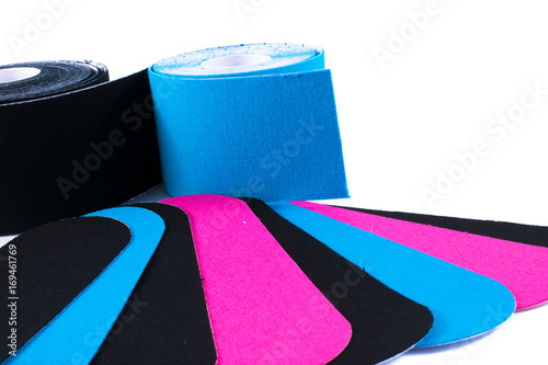 colorful kinesiology tape. Physiotherapy and therapeutic tape for wrist pain, aches and tension. elastic therapeutic tape. adhesive tape and alternative medicine. photo