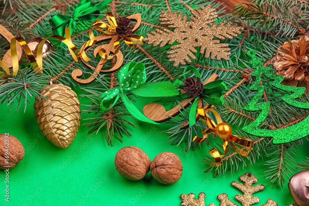 Beautiful composition with fir tree branches and decorations on color background. Christmas music concept Beautiful composition with fir tree branches and decorations on color background. Christmas music concept