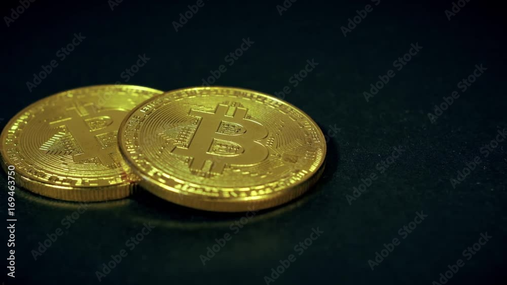 Crypto currency Gold Bitcoin - BTC - Bit Coin. Macro shots crypto currency Bitcoin coins. Reflection of light in a coin. Crypto currency Gold Bitcoin - BTC - Bit Coin. Macro shots crypto currency Bitcoin coins. Reflection of light in a coin.