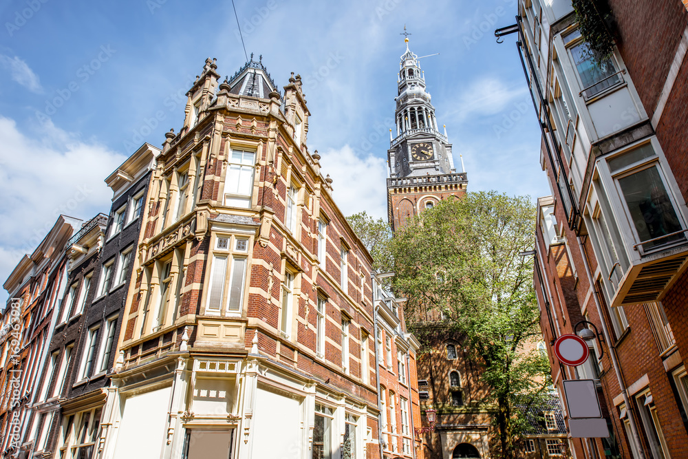 View on the beautiful old buildings in Amsterdam city during the sunny weather