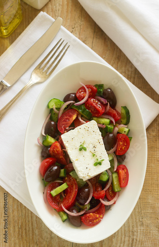 Traditional greek salad with fresh vegetables, feta cheese and olives.