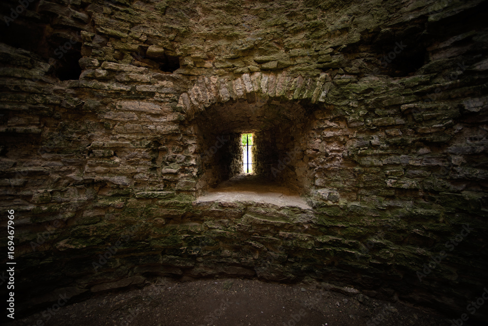 Window loophole in the ancient medieval limestone tower