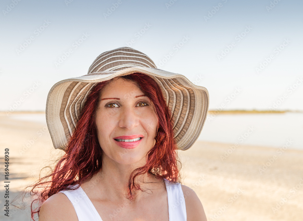 redhead mature woman on seaside
